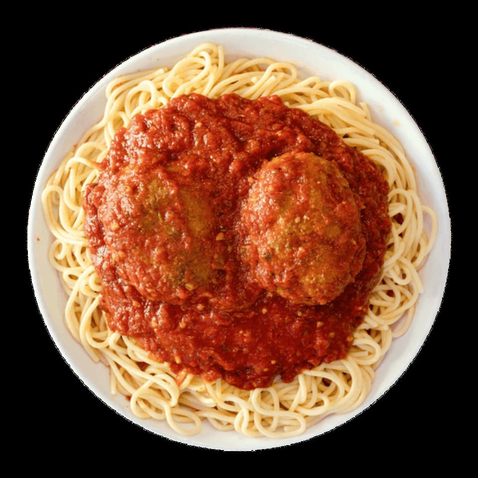 Spaghetti and meatballs with rich red marinara sauce in a white bowl, viewed from above.